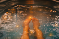 Evening wood-fired hot tub soak and peaceful nights at Piney Bend Riverfront cabins
