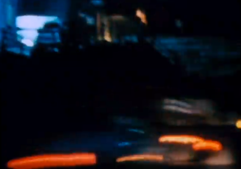 Car lights under bridge