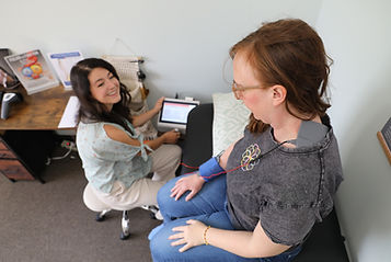 Dr. Michelle Green setting up a patient on HiTop therapy at The Well Healing Center in Lafayette, Colorado