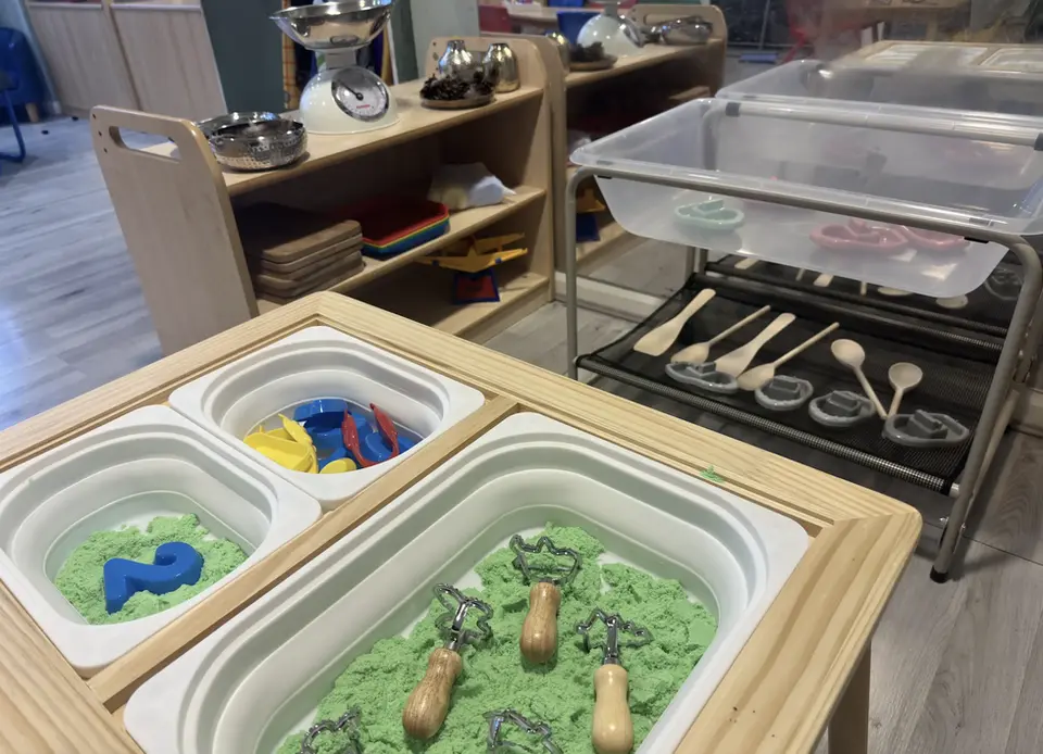 Sand table with utensils, water tray with measuring facilities