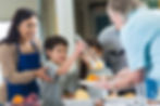 young-hispanic-family-volunteering-to-serve-food-in-soup-kitchen-536050871-585168655f9b58a