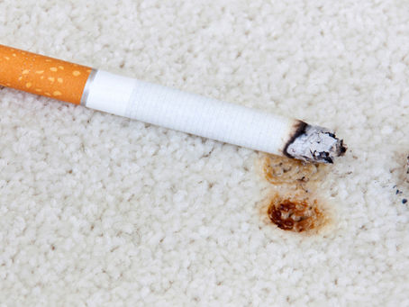 Zigarette auf Teppich
