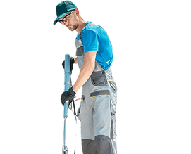 Worker using pressure washer for cleaning