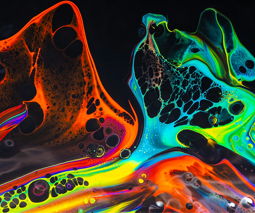 Inks mixed together in a colorful pattern of black, orange, green, blue, red and purple