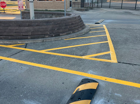 Commercial parking lot striping project with machine application and crisp yellow line markings