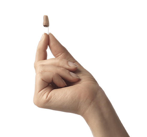Hand holding invisible-in-the-ear (IIC) hearing aid