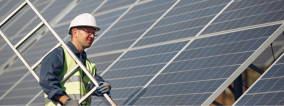 man-with-white-helmet-near-solar-panel 1