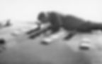 An airman lays on the wing while re-arming a Spitfire at Biggin Hill, September 1940.