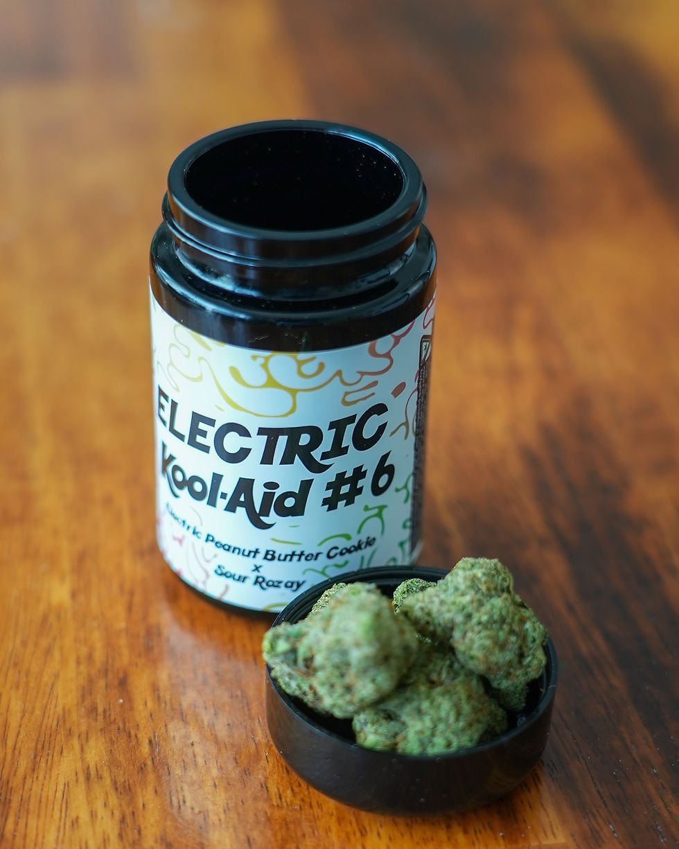 Peninsula Gardens Electric Kool-Aid #6 cannabis flower displayed beside its branded jar, featuring Electric Peanut Butter Cookie x Sour Rozay genetics.
