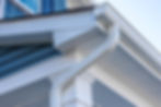 Seamless aluminum gutters installed on residential roofline.