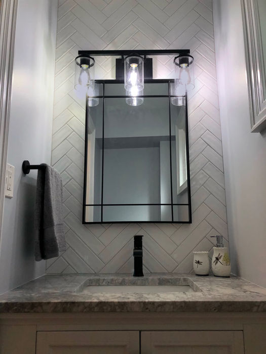 RenoVision Interiors Herringbone Tile Bathroom