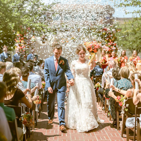 Bride and groom walking back down the aisle as husband and wife after their Bentley House wedding ceremony in The Courtyard in St. George, Utah.