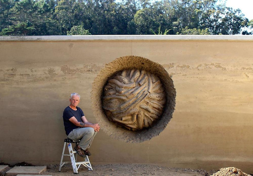 Andy Goldsworthy with his art installation "Earth Wall", 2014