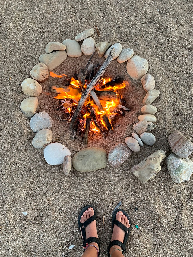 Fireplace of the open fire for the group of the nature therapy retreat on the beach in Greece