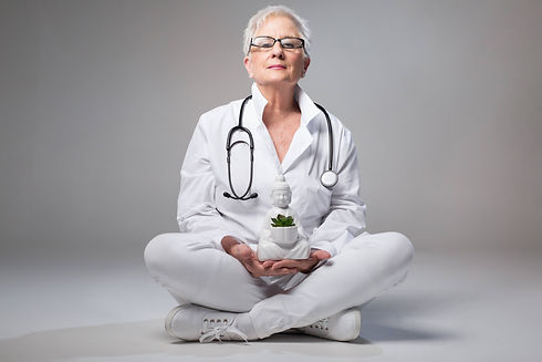 Doctor Holistic Medicine Female Caucasian Holding Plant Dressed in White.jpeg