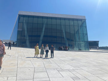 Choir members in front of the Oslo Opera
