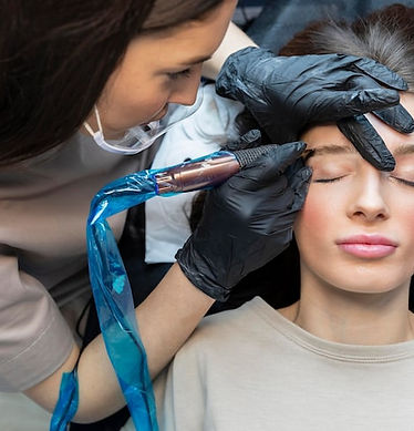 beautician-doing-eyebrow-treatment-her-client_23-2148910497.jpg