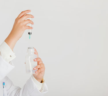 female-doctor-with-container-needle.jpg