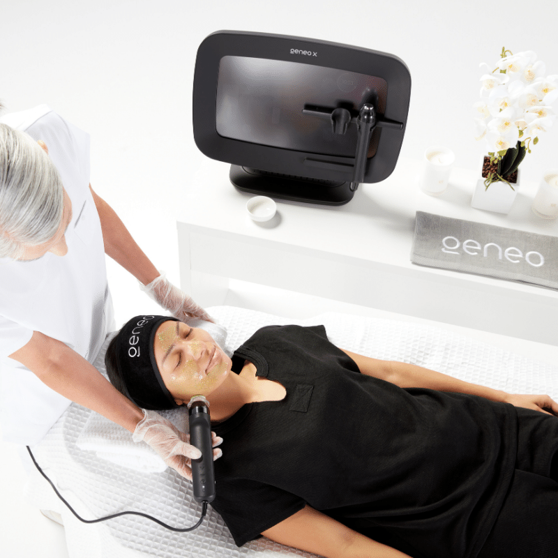 71-Top-View-of-Woman-Receiving-Geneo-Detox-Facial-Treatment-with-Geneo-X-Machine-in-Backgr