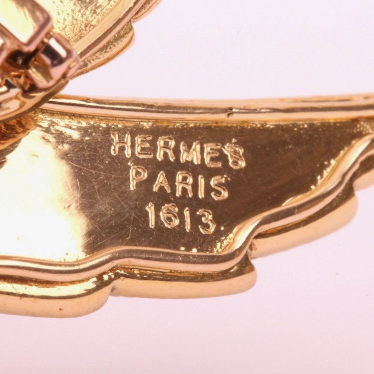Signature Hermès Paris et numéro de serie sur une broche oiseau