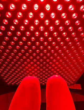 Red Light Therapy Treatment with LED Panel. Close-up view of a person receiving red light