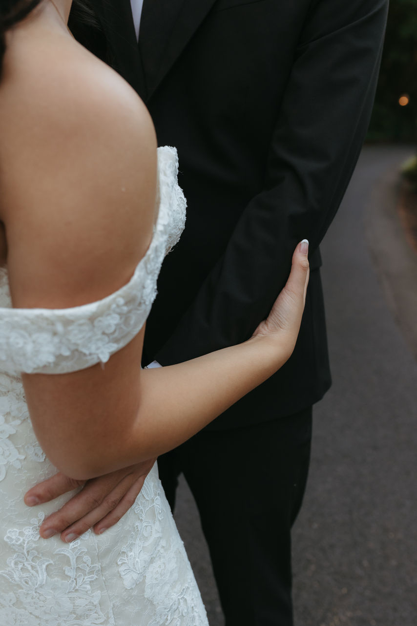 Bride and groom embracing during a romantic portrait session at Abernethy Center wedding venue