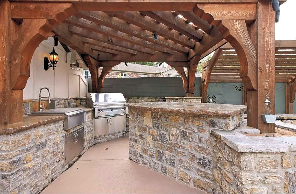 custom covered patio with outdoor kitchen in tulsa ok