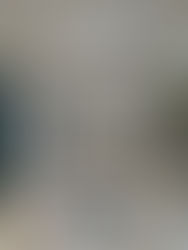 Interior view of a new build extension under construction, showing plastered walls, installed sliding doors, Velux roof windows and ongoing first-fix works.