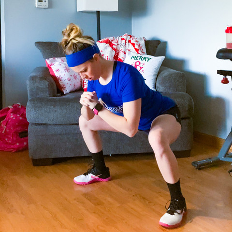 female wide body weight squat