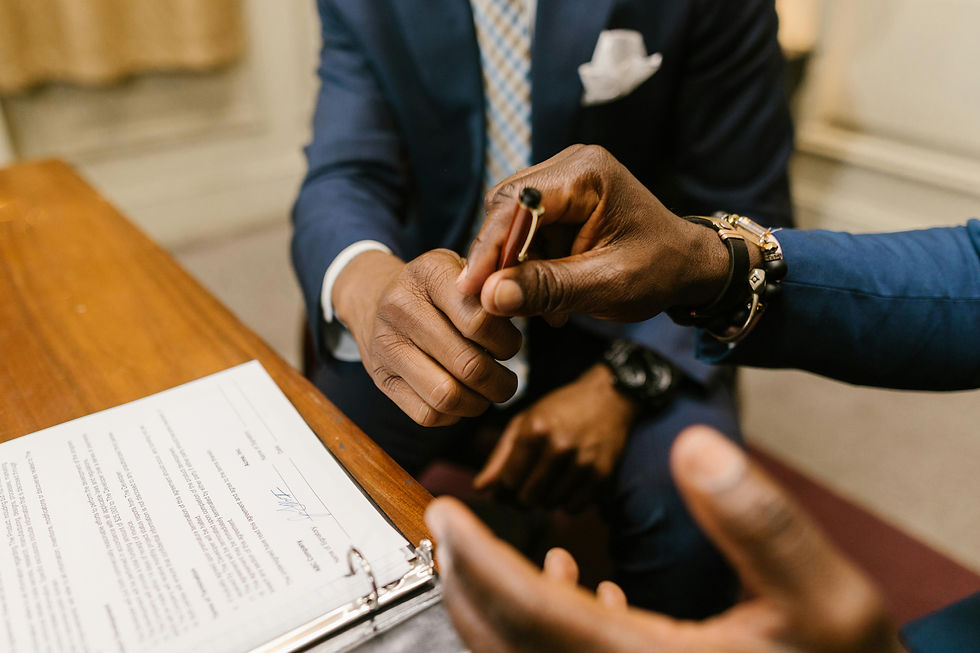 Two business professionals signing a supplier contract agreement for China sourcing partnership