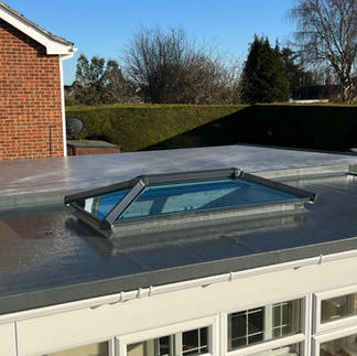 Stylish insulated conservatory roof installed to improve energy efficiency and comfort.