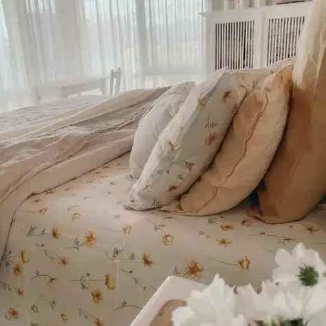 Buttercups French flax linen sheet and pillowcases styled on a bed