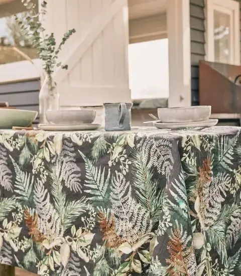 Thumbnail: Moonlit Ferns French flax linen tablecloth styled on a table in an outdoor setting