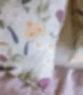Wild Blooms French flax linen pillowcases styled on bed