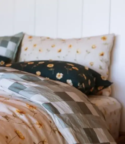 Layered linen bedding with patterned linen pillowcases and sheets