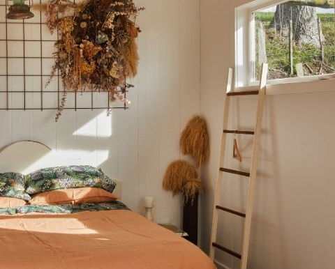 Linen bedding in a sunlit bedroom showing breathable natural sleep environment