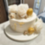 Cream and gold cake with roses