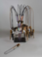 Vee Toys PuRRfect Bouncer leather cat wands displayed in a clear display stand with a calico kitten