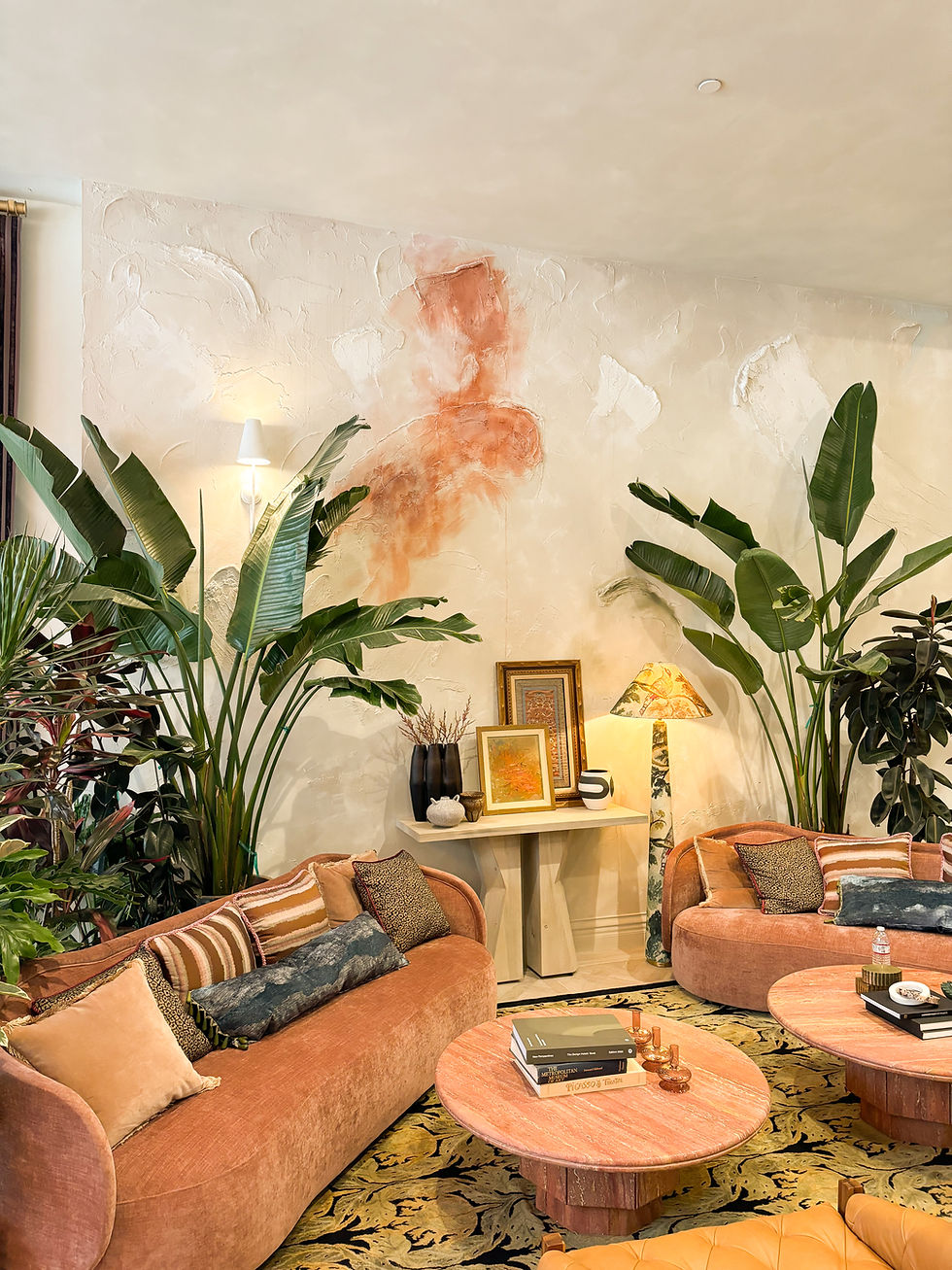 Living room with terracotta sofas and tropical plants
