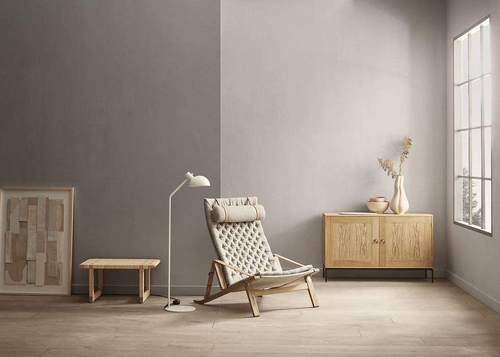 A modern tufted camp chair from Carl & Son sits in a beige-painted room with wooden floors, a white floor lamp, and a wooden credenza.