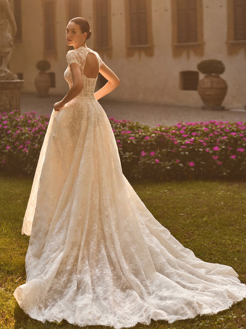 Abito da sposa principessa in pizzo rebrodé Alberto Palatchi 2027 con bustier scollo a cuore fiocco raso gonna ampia giacca pizzo e velo tulle doppio look
