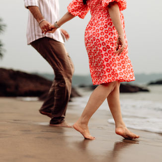 Romantic beach pre-wedding shoot near Belgaum by Akari Photography
Couple walking on beach during pre-wedding shoot at sunset
Beachside candid moments captured by pre-wedding photographer in Belgaum