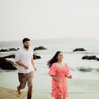 Couple silhouette shot on the beach at dusk in Goa by Akari Photography