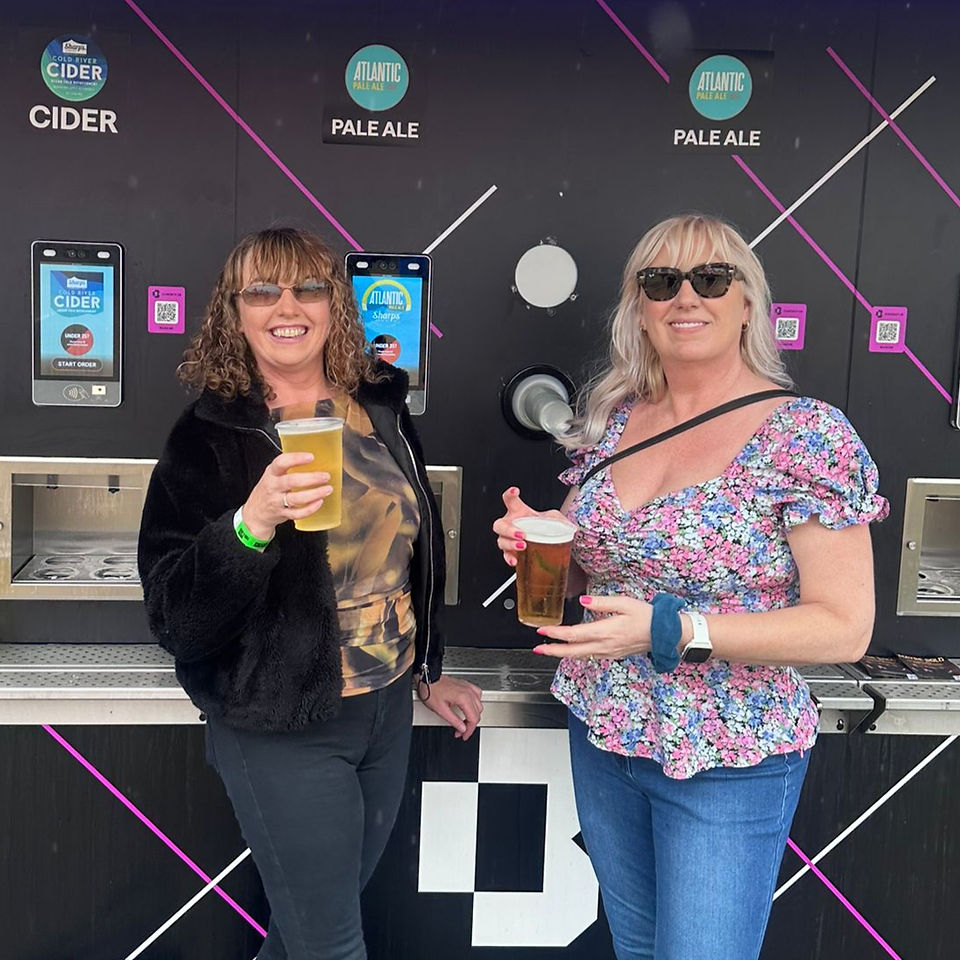 Two women with pints of beer