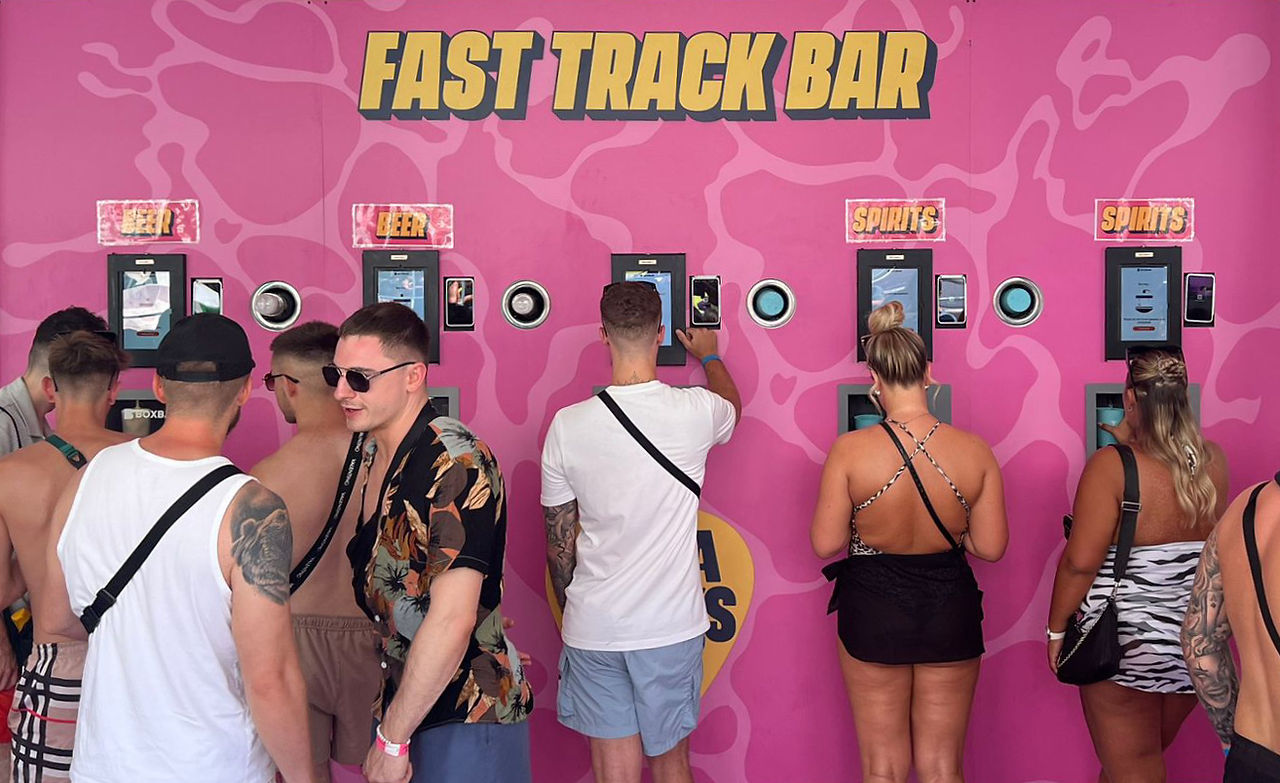 Self-service bar built into pink wall