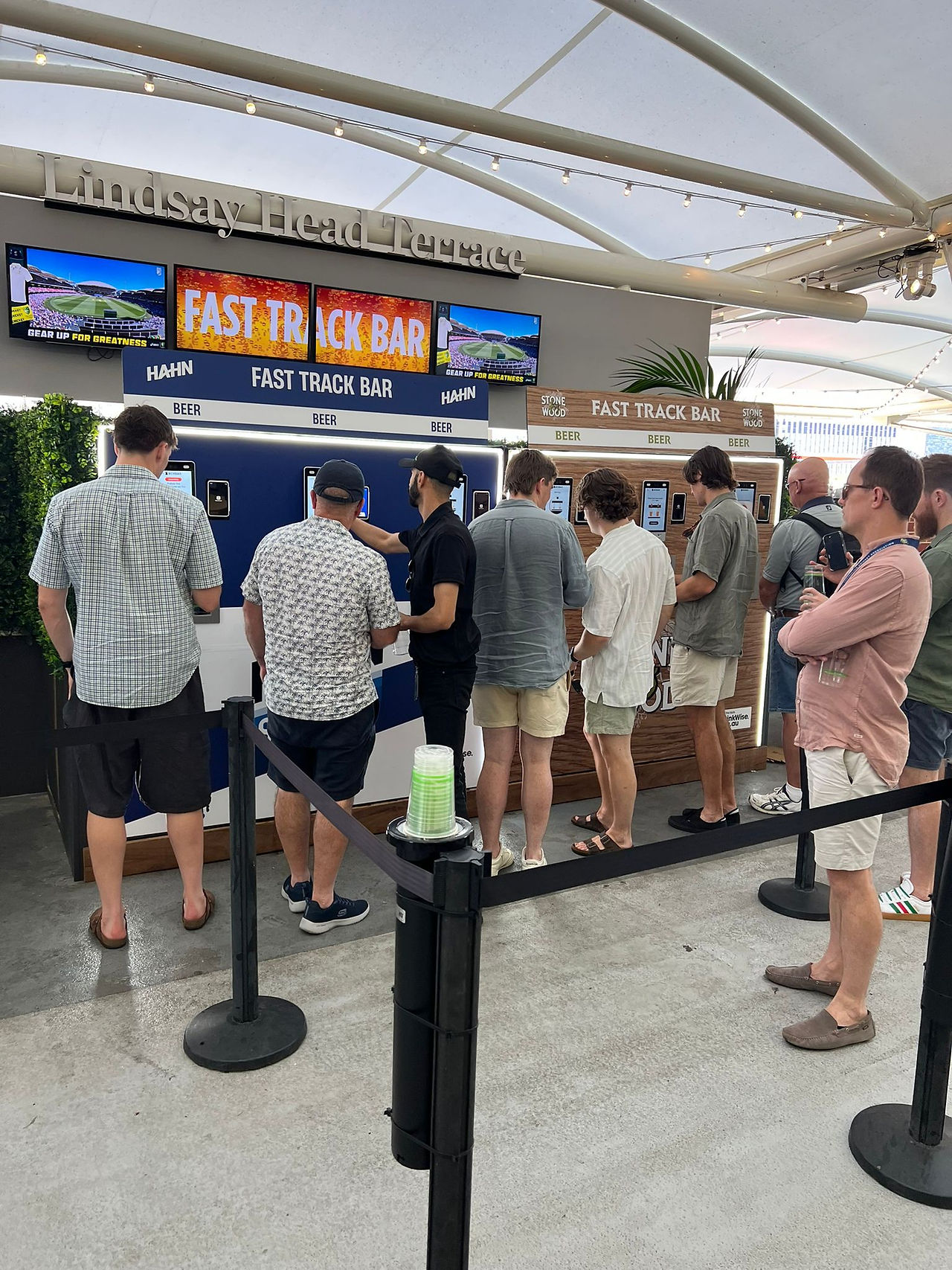 People order beer at machines