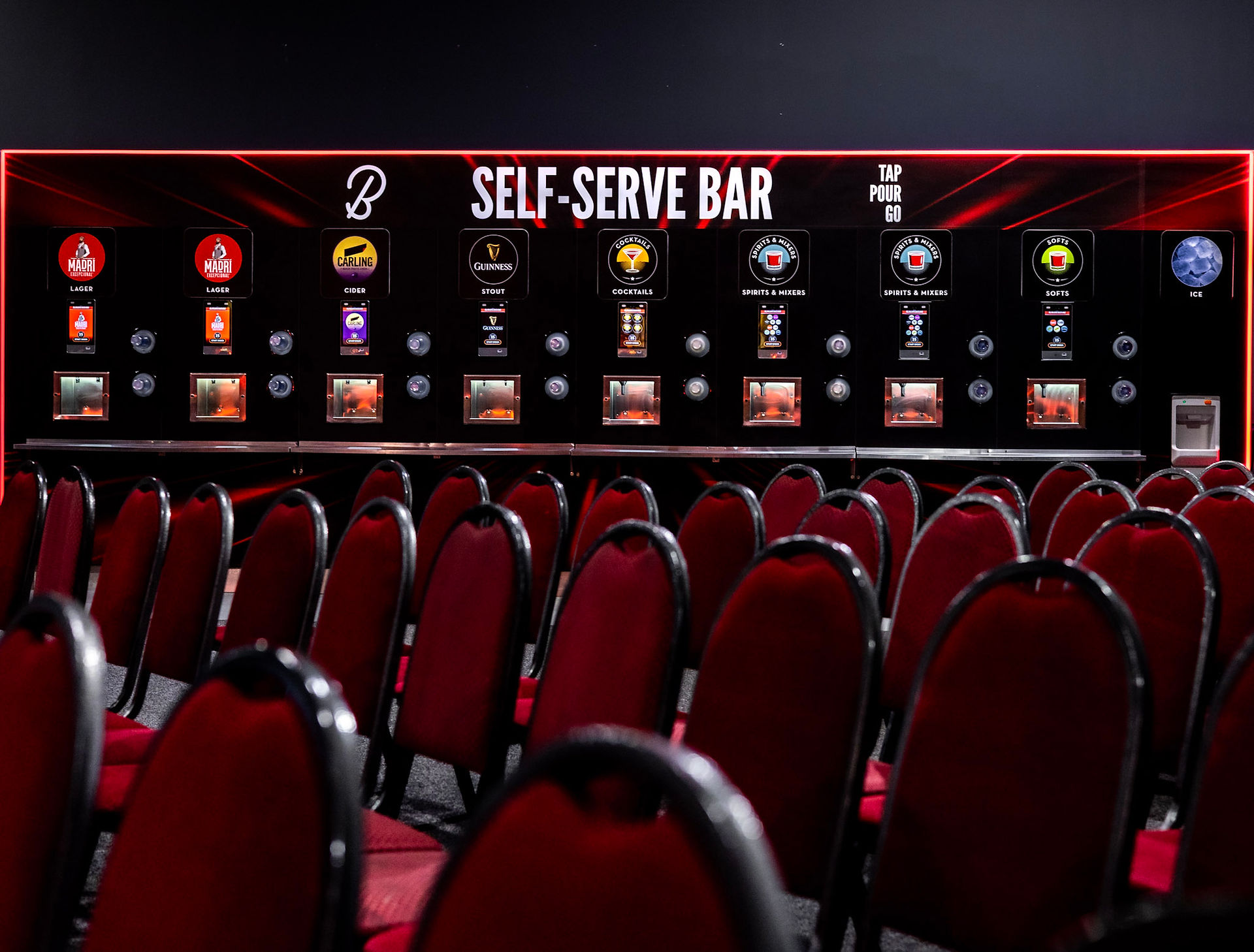Red and black self-service bar wall behind red seats