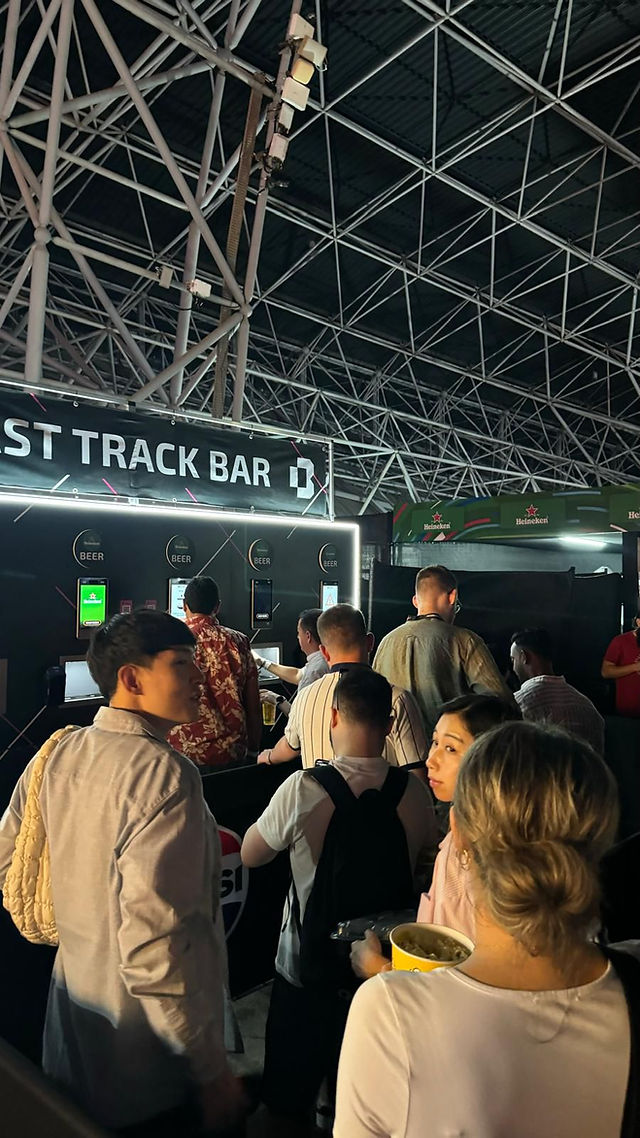 Customers queuing to use self service bar machines