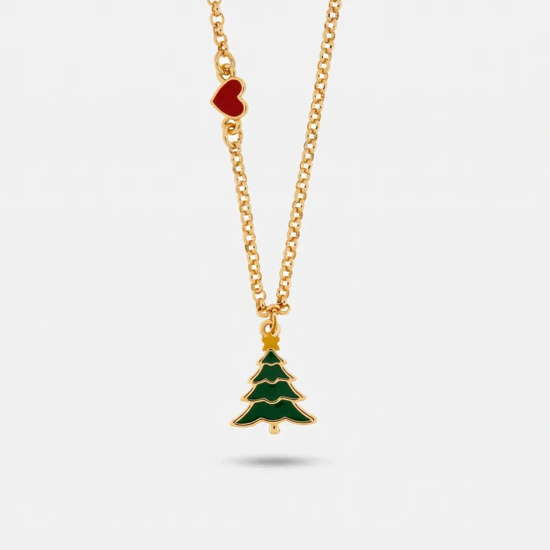 Collana BySimon dorata con albero di Natale verde, stella in alto e piccolo cuore rosso laterale.