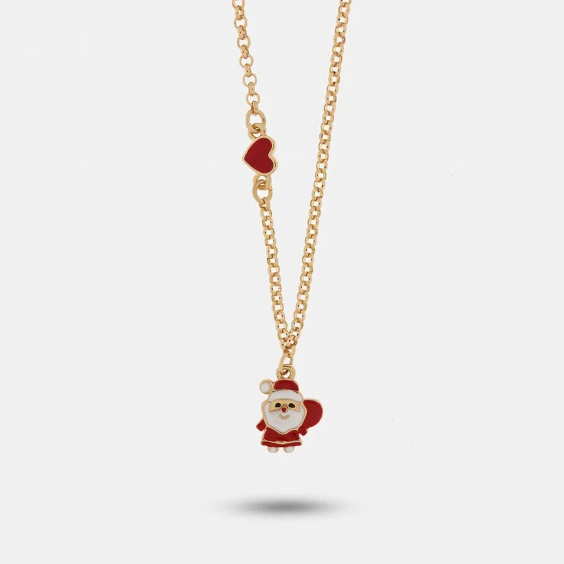 Collana BySimon dorata con pendente Babbo Natale bianco e rosso e piccolo cuore rosso laterale.